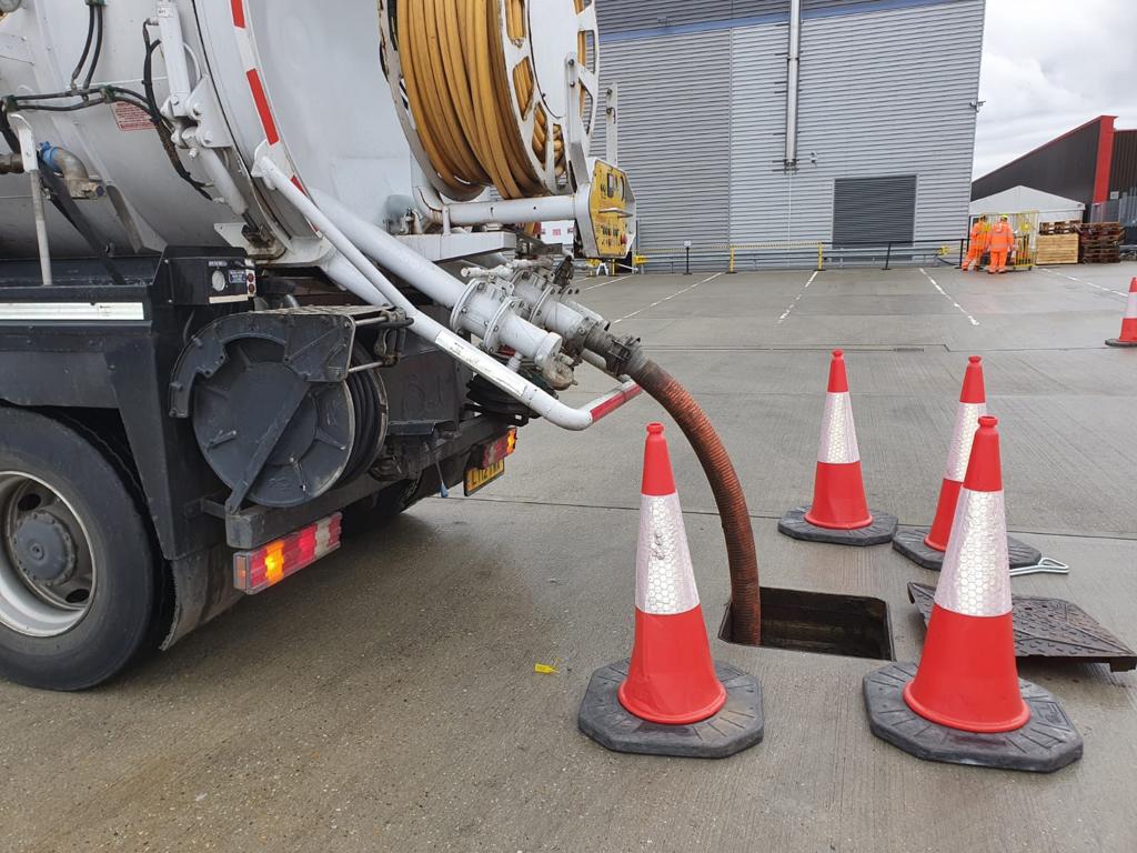 Tanker pumping a drain